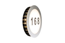 93769 Spec.Haus-Nr. Sun IP44 LED 1x5,6W Edelst The Sun house number luminaire is specially protected from the ingress of moisture and dusts thanks to IP44 protection. Even where an illuminated house number is not required by law, the surface-mounted luminaire enhances any house entrance with a sunbeam light effect. Additionally, the decorative eye-catcher makes it easier for your visitors or the postman to find the right house when it is dark outside. You can stick the combination of figures you want onto the luminaire using the alphabet and number sets in plain black delivered with the product. 937.69 Paulmann
